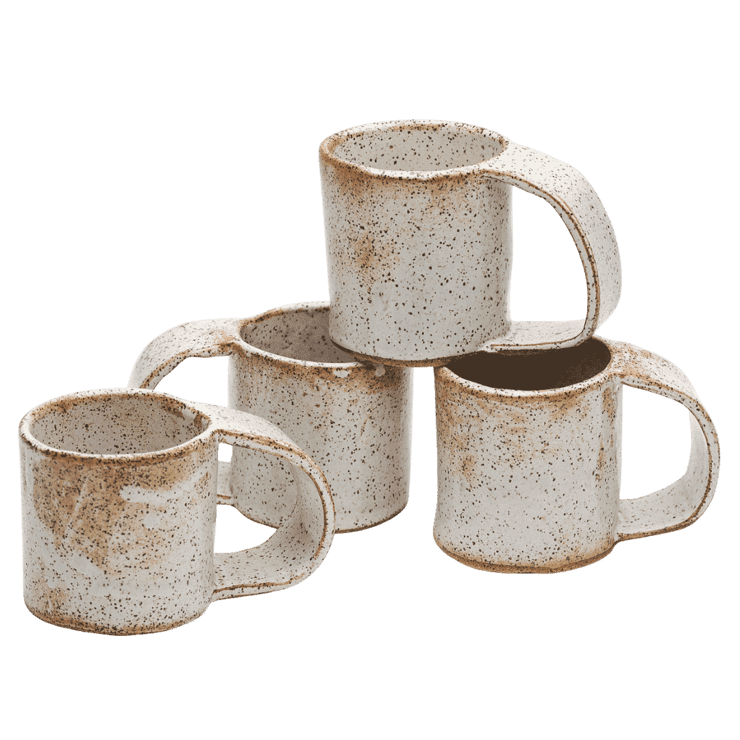 Set of four handmade ceramic coffee mugs with speckled ivory glaze, featuring ergonomic handles and organic forms arranged in casual grouping